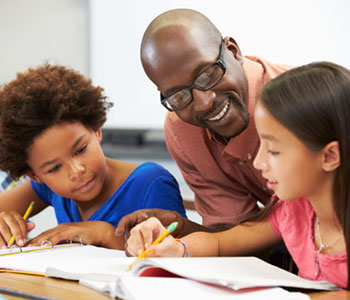 Man helping children read and learn, with S.L. Hunter Speechworks in Burlington Ontario