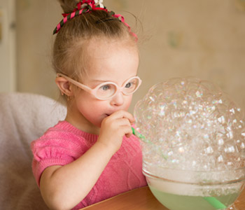 Young girl learning about oral placement therapy-SL Hunter Speechworks