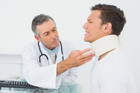 Man-who-was-in-a-car-accident-being-checked-by-a-doctor.jpg Man-who-was-in-a-car-accident-being-checked-by-a-doctor.jpg